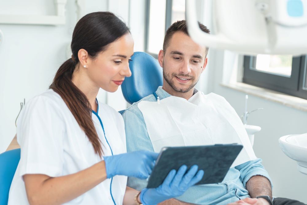 Orthodontist showing patient x-rays