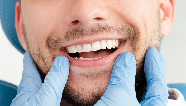 Man having teeth examined at Orthdontist