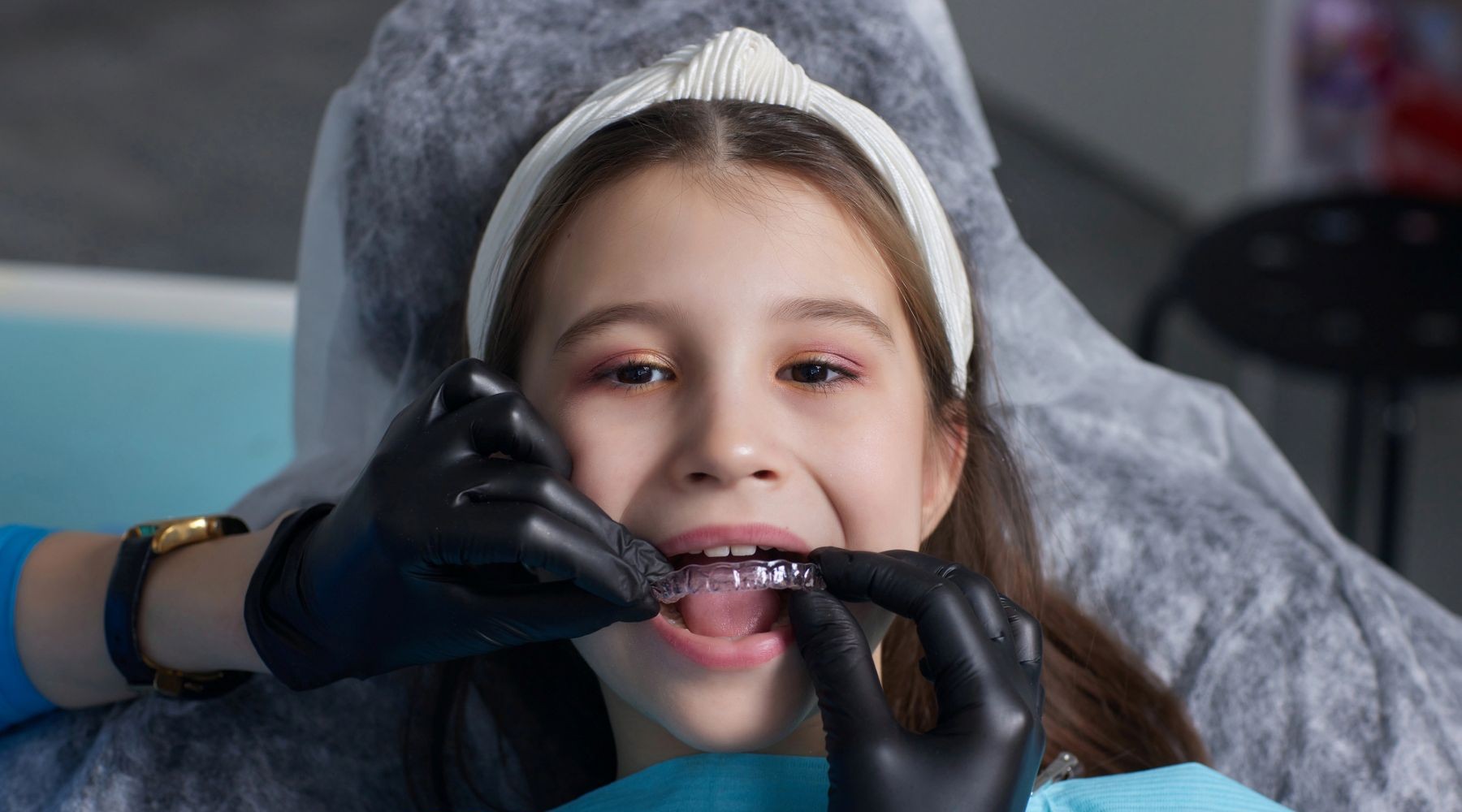 child having clear aligners fitted